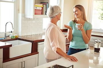 Image showing Mother, coffee or happy woman chatting in kitchen in family home bonding or enjoying quality time together. Smile, retirement or daughter talking, relaxing or drinking tea with senior parent on break