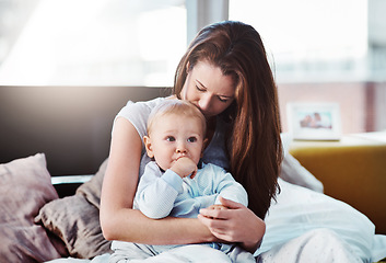 Image showing Baby, mother and hug in bed with love or bedroom, peace in morning and newborn together, relax and calm mom in home. Postpartum, boy and quality time with mama to enjoy, support or care for child