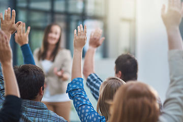 Image showing Woman speaker at conference, group of people with hands up for question or answer at training presentation or meeting. Feedback, opinion and ideas, men and women at seminar, hand in air and questions