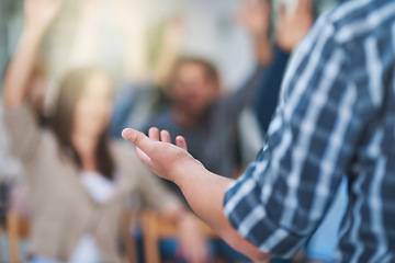 Image showing Speaker at seminar, audience with hands up for questions and answers at training presentation or meeting. Feedback, opinion and ideas, group of people at conference, hand in air for question or input