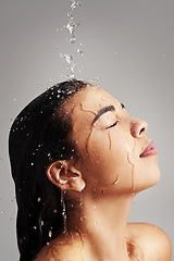 Image showing Shower, water and face profile of woman in studio on gray background for wellness, cleaning and satisfaction. Skincare, bathroom and female person with beauty for washing hair, hygiene and cleansing