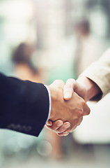 Image showing Partnership, deal and business people shaking hands in office after a meeting or interview. Collaboration, team and closeup of corporate employees with handshake for greeting or welcome in workplace.