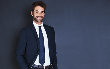 Image showing Portrait, mockup and smile with a formal businessman in studio on a blue background for about us corporate style. Success, fashion and a confident male employee in a suit for professional power