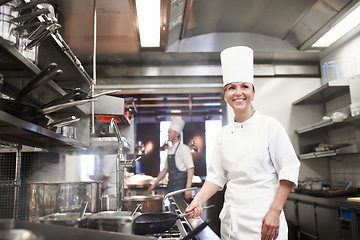 Image showing Chef, woman and happy with frying pan in kitchen, catering service and prepare food for fine dining in restaurant. Professional, cooking and female person saute, cook and thinking about hospitality.