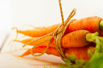 Image showing baby carrots bunch tied with rope