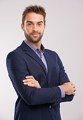 Image showing Portrait of business man, arms crossed with confidence in a suit isolated on studio background. Professional mindset, career success and businessman with corporate male employee and leadership