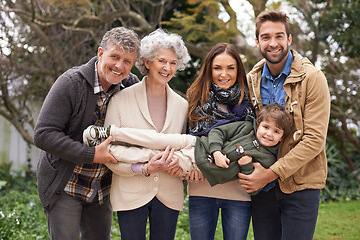 Image showing Happy family, portrait and grandparents with parents and child in a park on outdoor vacation or holiday. Face of mother, happiness and father play with kid as love, care and together in nature