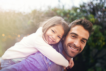 Image showing Happy, piggyback and portrait of father and daughter in nature for bonding, laughing or affectionate. Smile, relax and happiness with man carrying young child in park for support, weekend and hugging