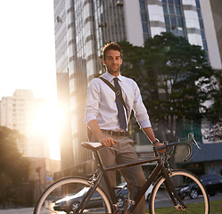 Image showing Cycling, portrait and business man in city for commute, carbon neutral and transportation. Sustainable, professional and travel with male employee walking with bike in urban town for journey and trip