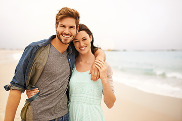 Image showing Love, hug and portrait of couple at beach for travel, romance and freedom together outdoors. Face, smile and happy woman embracing man while walking, vacation or holiday, bond and fun in Miami