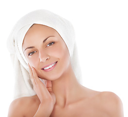 Image showing Skincare, portrait and happy woman with towel in studio for cosmetics, dermatology and results on white background. Soft, beauty and lady touching her face after cleaning, shower or hair care routine