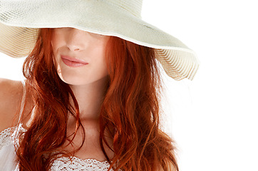 Image showing Woman, fashion and hiding with hat in white background, isolated studio and elegant style. Hidden face, mystery lady and female model with bold red hair, cool summer accessory and mysterious beauty