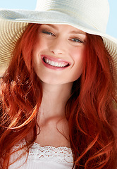 Image showing Happy woman, portrait and face with straw hat for summer vacation, confident style and sunny holiday. Female person, red hair and smile with fashion accessory, freedom and happiness to relax outdoor