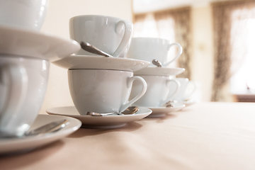 Image showing Many cups on table,