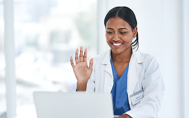 Image showing Hand, hello and woman doctor on laptop video call for online consulting, help and advice in a hospital. Telehealth, hi and female healthcare expert on virtual consult or medical conference on space