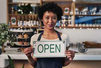 Image showing Woman, open sign and portrait in cafe of small business owner or waitress for morning or ready to serve. Female person or restaurant server holding board for coffee shop, store or cafeteria opening