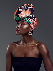 Image showing African fashion, makeup and face of black woman in studio on gray background with luxury, cosmetics and beauty. Glamour, culture and female person glow in exotic jewelry, traditional style and scarf