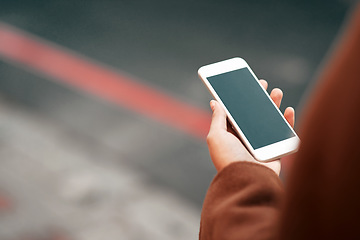 Image showing Woman, hands and phone in city with mockup screen for travel, location or road side service. Hand of female person or traveler holding mobile smartphone app with display for copy space in urban town