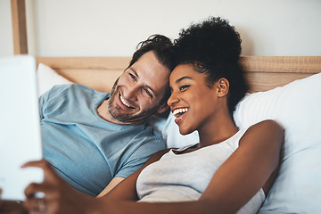 Image showing Happy interracial couple, relax and bed for selfie, photo or social media post together at home. Man and woman person with smile for fun profile picture, morning or online vlog in bedroom at a house