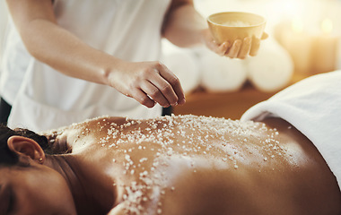 Image showing Woman, hands and salt in massage at spa for skincare, exfoliation or body treatment at resort. Hand of masseuse applying salts to back skin for relaxation, therapy or zen in healthy wellness at salon