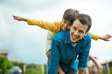 Image showing Portrait, children and a son on back of his dad outdoor in the garden to fly like an airplane while bonding together. Family, kids and a father carrying his boy child while playing a game in the yard