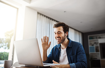 Image showing Business man, video call and laptop with wave in home office for hello, audio and communication at desk. Young businessman, computer and earphones for webinar, online consultation and remote work