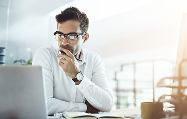 Image showing Computer, thinking and business man in office, working on project or email. Laptop, professional and male person problem solving, looking for solution or planning, reading or focus on decision making