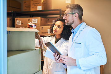 Image showing Tablet, box and pharmacy with people and inventory for shipping, cargo or medical supplies. Digital, checklist and delivery with man and woman in storage room for medicine, healthcare and drugs store