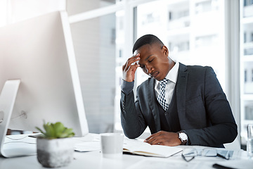 Image showing Black man in business, headache and stress in workplace with corporate burnout, depression and pain in office. Male professional at desk, migraine and tired, overworked with anxiety and work crisis