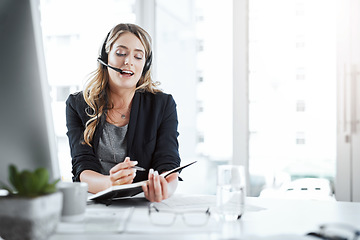 Image showing Secretary, receptionist and woman writing notes in the office planning company schedule. Call center, telemarketing and female customer support agent working on crm strategy with desktop in workplace