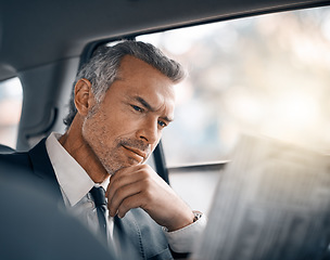 Image showing Man, reading newspaper and car for business travel, journey or drive while thinking of news. Professional male person with media paper in passenger seat for work with luxury transportation or a taxi