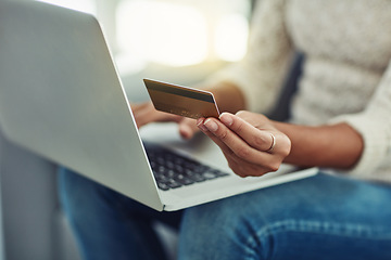 Image showing Laptop, credit card and woman online shopping with payment on the internet on her home living room sofa. Ecommerce, computer and hands of person doing website payment on an app, connection or web