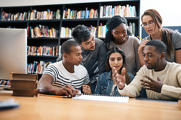 Image showing Students in library, studying together and discussion, exam or research for project, education and teamwork. Diversity, young men and women in study group and learning with collaboration on campus