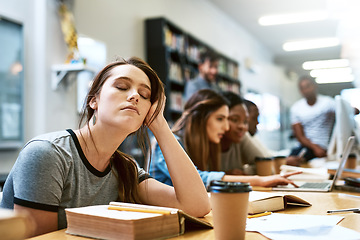 Image showing Woman, tired and books for studying at library, college or campus with stress, anxiety or burnout. University student, girl and headache with education, study and fatigue on face at school with sleep