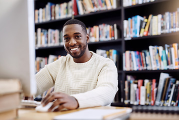 Image showing Portrait, smile and black man in a library, computer and search website for information, research and knowledge. Face, male person and student with technology, internet and university for education