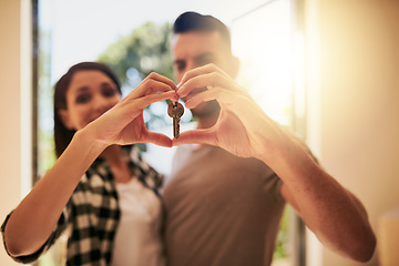 Image showing Heart, hands and couple with a keys, home and happiness for growth, development and real estate. Partners, man and woman with new property, symbol for love and goals with achievement and apartment