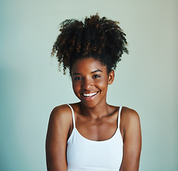 Image showing Happiness, youth and portrait of black woman on studio background with afro, smile and skincare. Beauty, dermatology and happy African girl, model with mockup, natural cosmetics and beautiful face.