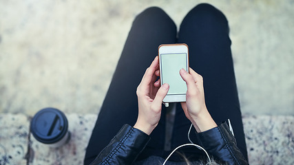 Image showing Top view, hands and phone screen with mockup in city, internet scroll and social media outdoor. Cellphone, space and hand of woman with marketing, advertising or commercial promotion in urban street