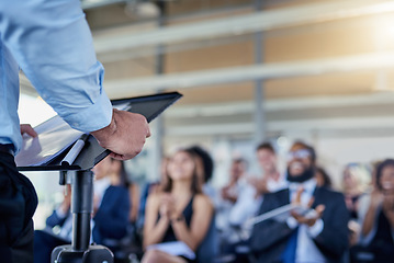 Image showing Closeup, presentation and speaker with crowd, applause or speech with workshop, seminar or discussion. Zoom, male person or leader with audience, announcement or motivation with support or solidarity