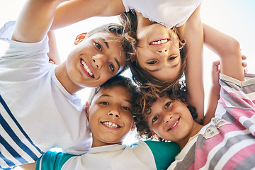 Image showing Portrait, low angle and a group of happy siblings or huddled together or hug in solidarity and smiling outdoors. Circle, brothers and sisters or excited children play or bonding and face outside