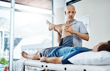 Image showing Physical therapy, healing and patient with pain, leg and recovery with injury, accident and consultation. Male person, employee or chiropractor with customer, healthcare and physiotherapist with care