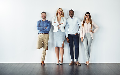 Image showing Portrait, diversity and collaboration with business people in studio together against a gray wall for mockup. Teamwork, confidence or professional with a group of colleagues in the office for success