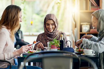 Image showing Muslim women, friends and eating in restaurant, together and talking with food, smile or happiness. Islamic woman, group and brunch with conversation, happy face or listening with social chat in cafe