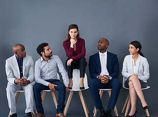 Image showing Business woman, interview and people on chairs for leadership or Human Resources job. Hiring and recruitment of diversity men and women with portrait of person ready for opportunity in a waiting room