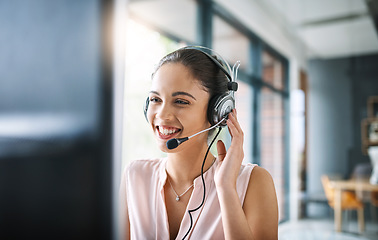 Image showing Call center, customer support and female telemarketing agent working on an online consultation in office. Contact us, communication and woman consultant with a crm strategy with headset in workplace.