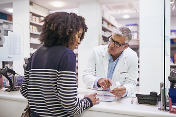 Image showing Black woman shopping, medicine or mature pharmacist in pharmacy for retail healthcare pills or advice. Trust, product or senior doctor helping a customer with prescription medication or medical drugs