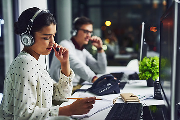 Image showing Call center, customer service and a woman at night, working in the office for consulting or assistance. CRM, contact us and support with a female consultant using a headset to help a client online