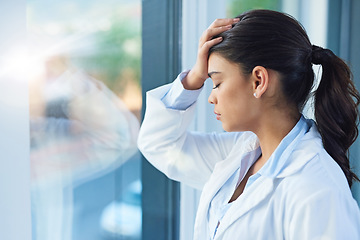 Image showing Stress, doctor and woman by window in hospital with worry, anxiety and tired with headache in clinic. Healthcare, mental health and sad female health worker with stressed out, depression and burnout