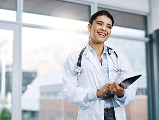 Image showing Funny, doctor and woman with tablet in hospital for research, telehealth and healthcare. Technology, happiness and female medical professional with touchscreen for online wellness, app and thinking.