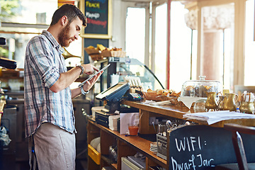 Image showing Tablet, cafe owner and man doing inventory while working on a startup business plan in a restaurant. Technology, entrepreneur and male barista doing research on a digital mobile in his coffee shop.
